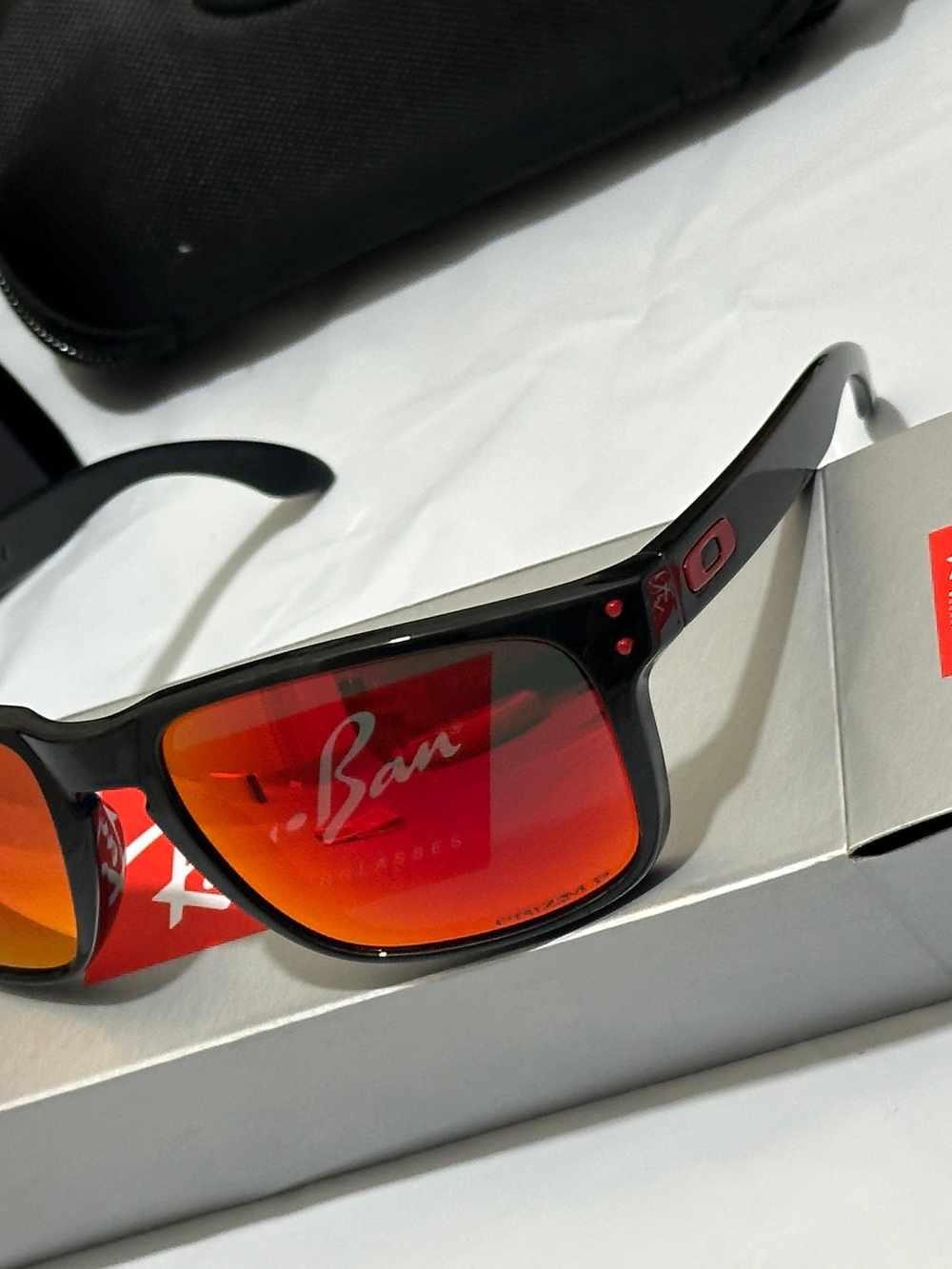 Ray-Ban Black Frame Sunglasses with Red-Orange Mirror Lenses